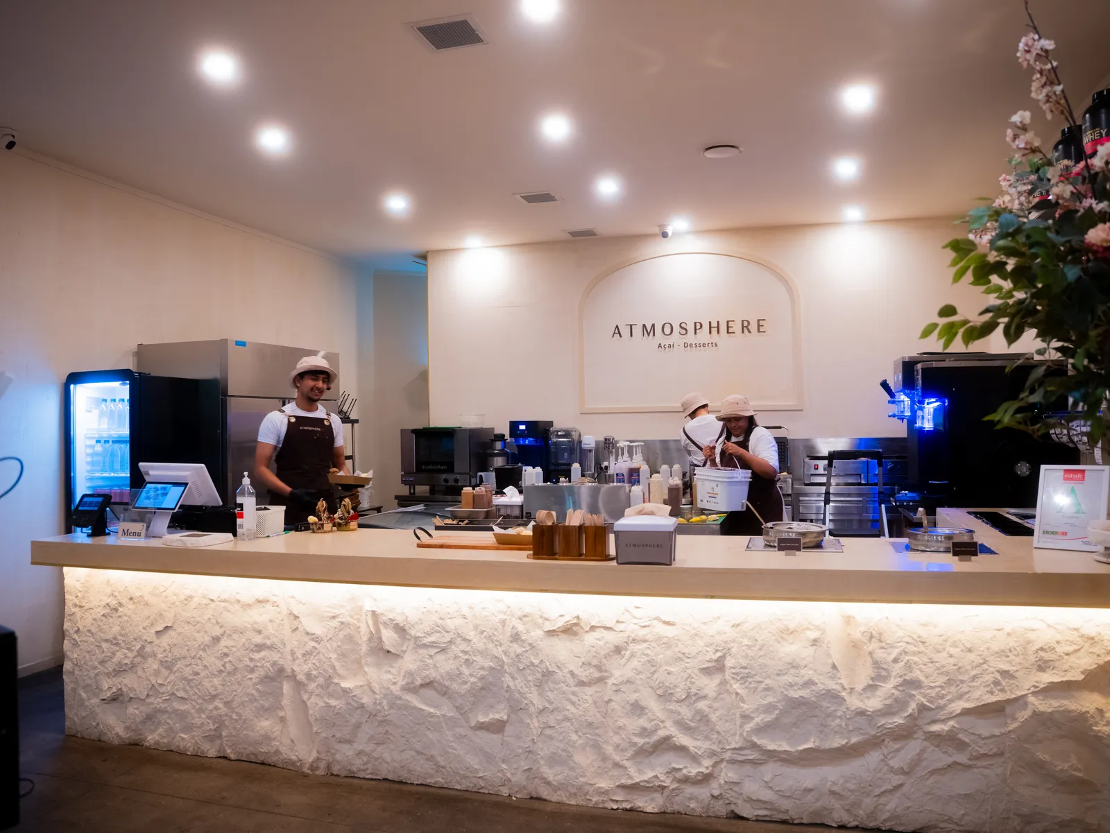 Inside Atmosphere: the glowing stone counter with the team prepping behind it