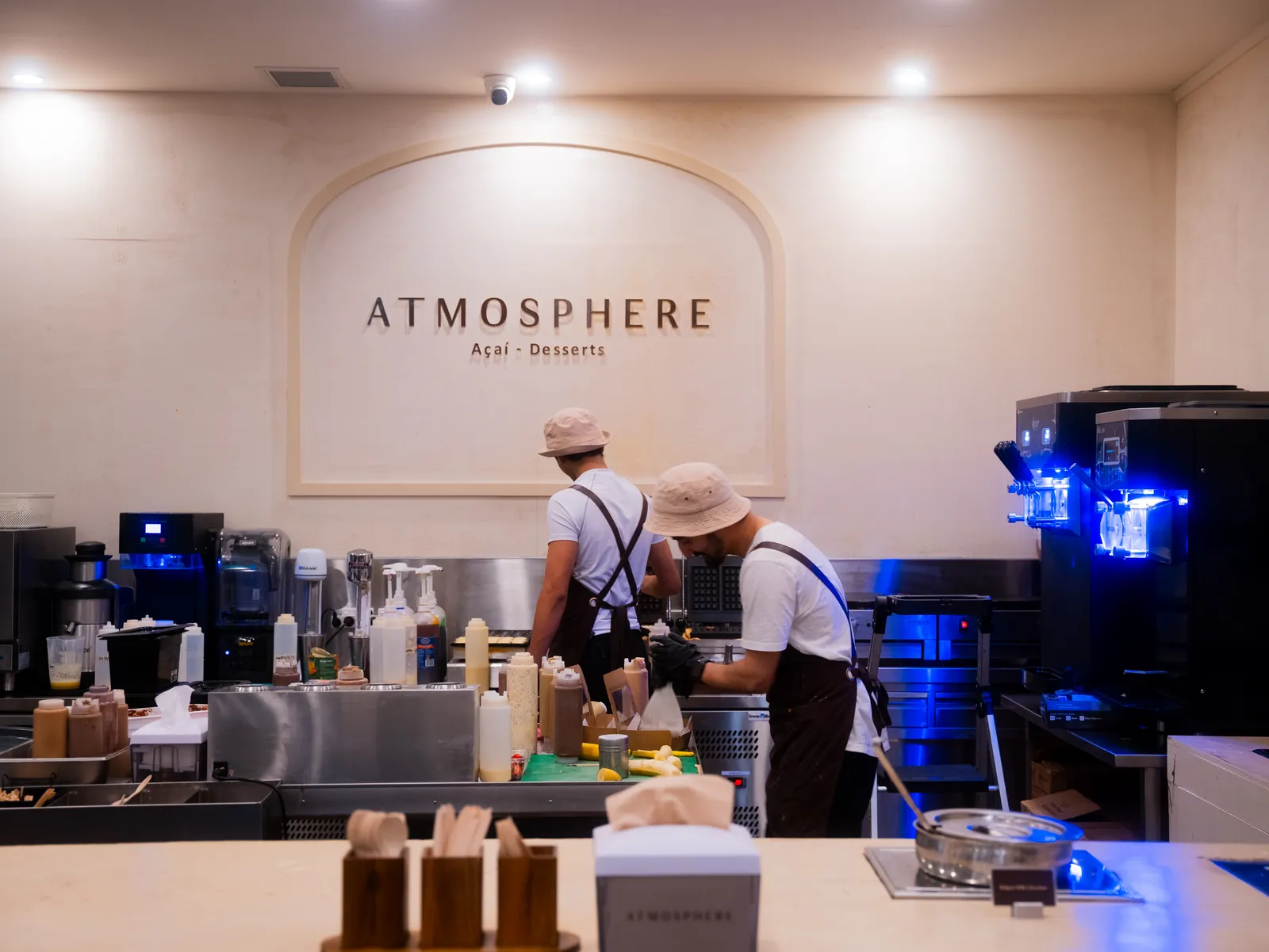 Atmosphere baristas building desserts at the prep station